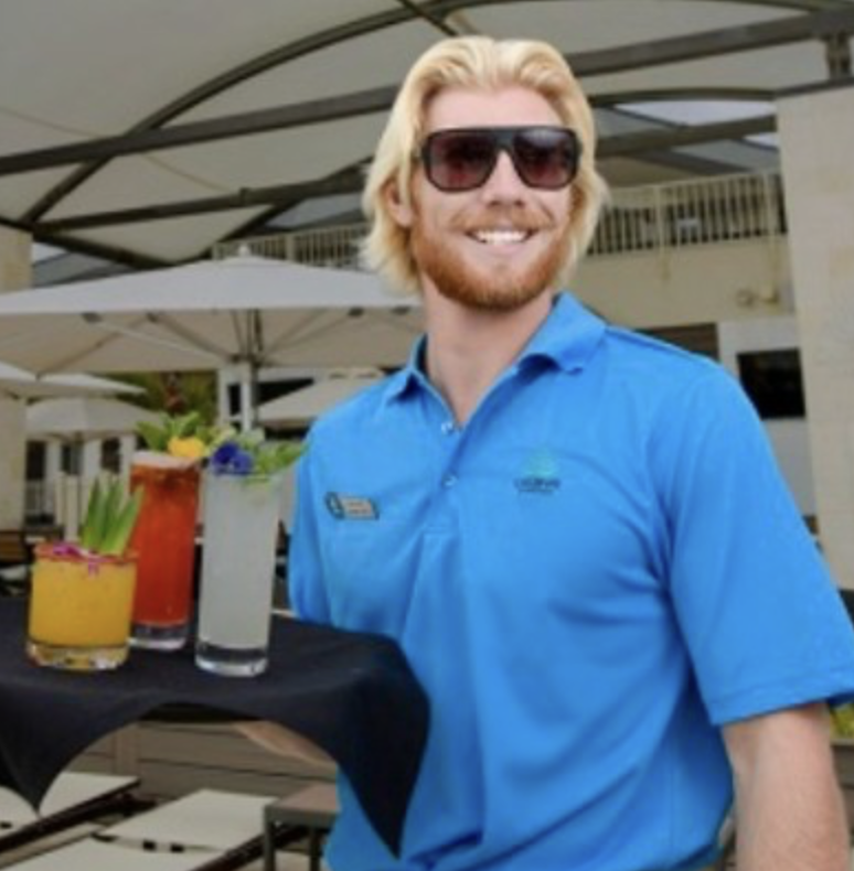 Asher serving drinks at the pool deck